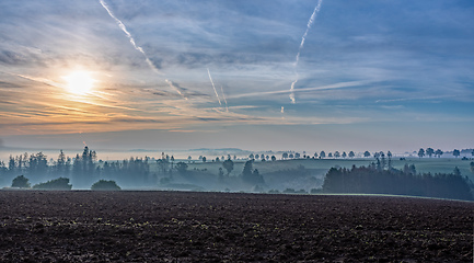 Image showing Autumn foggy and misty sunrise landscape