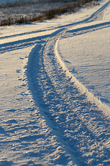 Image showing traces of the wheels of the car close-up