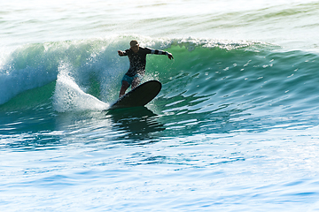 Image showing Surfing the waves