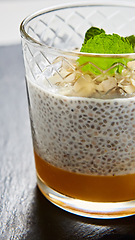 Image showing Mango yogurt with chia seeds for healthy breakfast on a white background