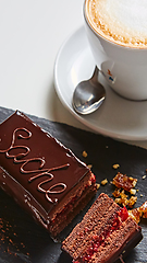 Image showing A piece of Sacher cake. Shallow dof.