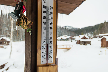 Image showing Thermometer on wood house panel