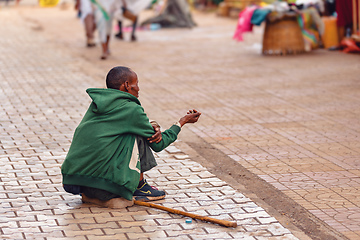 Image showing Begging people on the street at Easter