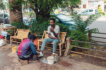 Image showing shoe cleaner on the street of Bahir Dar, Ethiopia