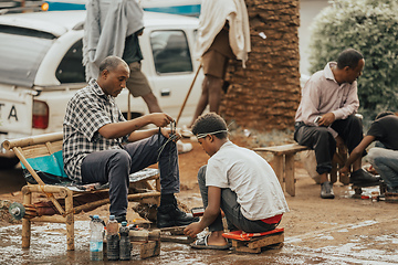 Image showing shoe cleaner on the street of Bahir Dar, Ethiopia