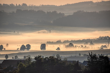 Image showing Fall foggy and misty sunrise landscape