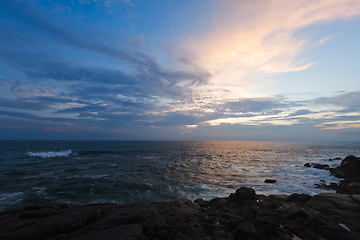 Image showing Rocky coast at sunset