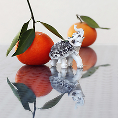 Image showing Toy Elephant and Tangerines