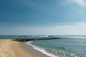 Image showing Wave breaker on beach