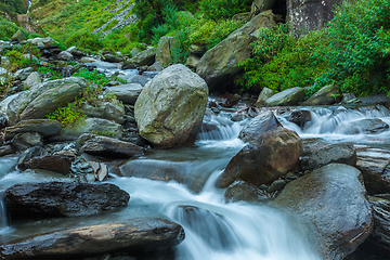 Image showing Cascade falls over mossy rocks