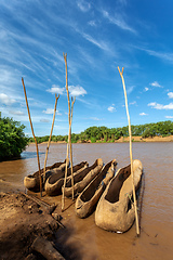 Image showing wooden coarse boat on mystical Omo river, Ethiopia