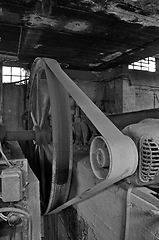 Image showing belt driven machinery in abandoned factory