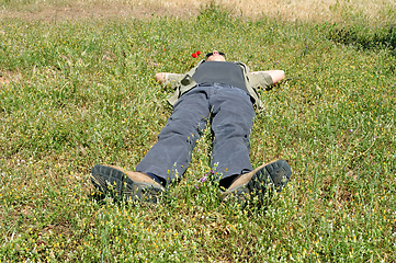 Image showing man lying on grass