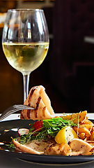 Image showing The grilled squid with salad. Shallow dof.