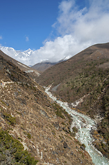 Image showing Lhotse summit, trail and river in the Himalayas