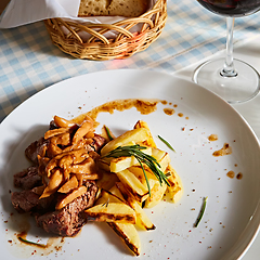 Image showing The potatoes fried with mushrooms and beef.