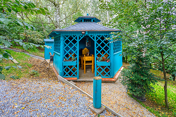 Image showing Lovely turquoise gazebo in garden