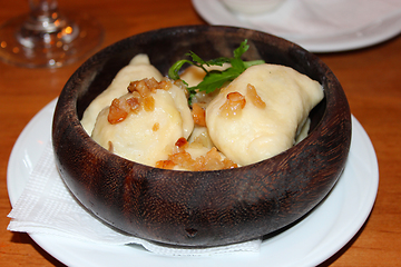 Image showing Varenyky with fried slices of bacon