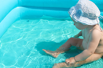 Image showing baby takes a bath in the swimming pool