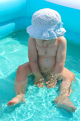 Image showing baby takes a bath in the swimming pool