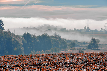 Image showing Fall foggy and misty sunrise landscape