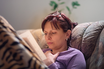 Image showing brunette woman reading books at home