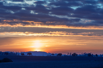 Image showing Autumn foggy and misty sunrise landscape