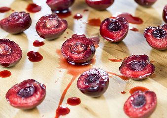 Image showing sliced red sweet cherries