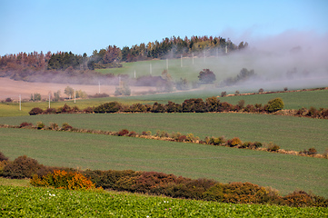 Image showing Fall foggy and misty sunrise landscape