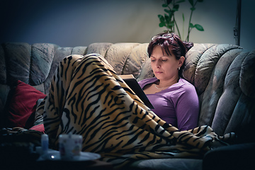 Image showing brunette woman reading books at home