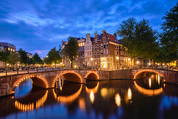 Image showing Amterdam canal, bridge and medieval houses in the evening