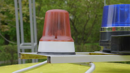 Image showing Flashing indicators on a roof of the police car costs.