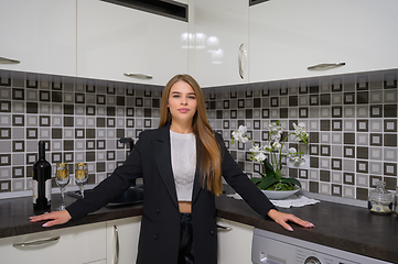 Image showing Young woman at luxury modern white kitchen interior in provence style