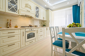 Image showing Beige, white and cyan furniture at kitchen in provence style,