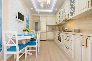 Image showing Beige, white and cyan furniture at kitchen in provence style,