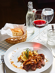 Image showing The potatoes fried with mushrooms and beef.