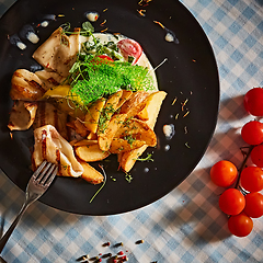 Image showing The grilled squid with salad. Shallow dof.