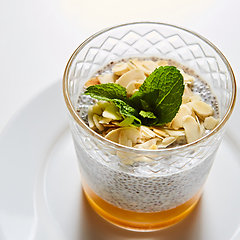 Image showing Mango yogurt with chia seeds for healthy breakfast on a white background