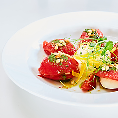 Image showing Mozzarella and tomato salad - caprese on the white plate. Shallow dof