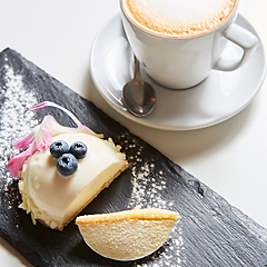 Image showing Vanilla bavarian mousse cake with cherries and dark chocolate on top. Made with cream cheese and whipped cream