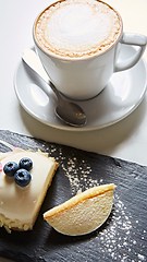 Image showing Vanilla bavarian mousse cake with cherries and dark chocolate on top. Made with cream cheese and whipped cream