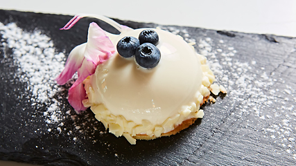 Image showing The vanilla mousse with blueberry. Shallow dof.