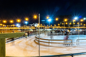 Image showing beautiful outdoor ice rink at night with lights