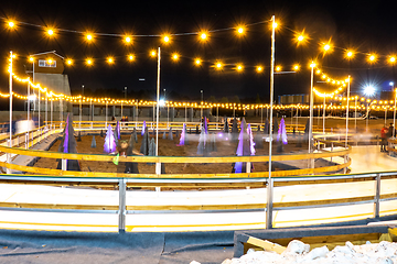 Image showing beautiful outdoor ice rink at night with lights