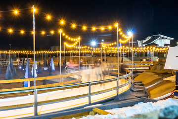 Image showing beautiful outdoor ice rink at night with lights