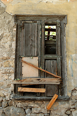 Image showing boarded up old window shutter