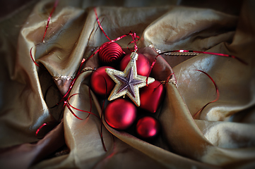 Image showing red baubles and golden star christmas ornaments