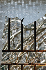 Image showing shattered glass rusty door frame