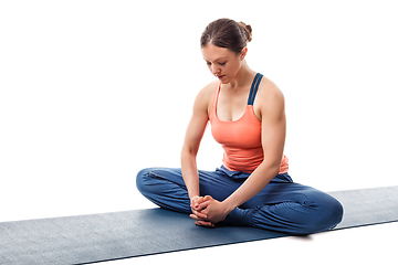 Image showing Woman practices yoga asana Baddha konasana