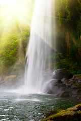 Image showing Waterfall in jungles with sun